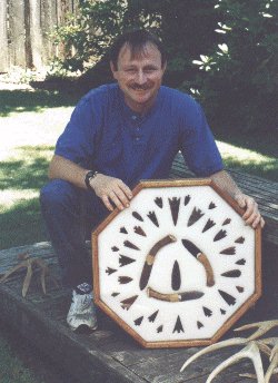 Artist with obsidian knife and 

arrowhead display